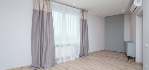 Empty room interior with parquet and curtains at home